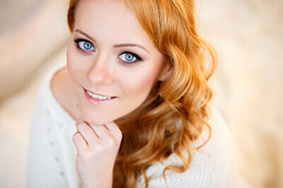 Woman smiling after receiving Skin Care treatment